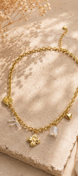 Schakelketting met bloem en parel strikje goud Sil - 187820